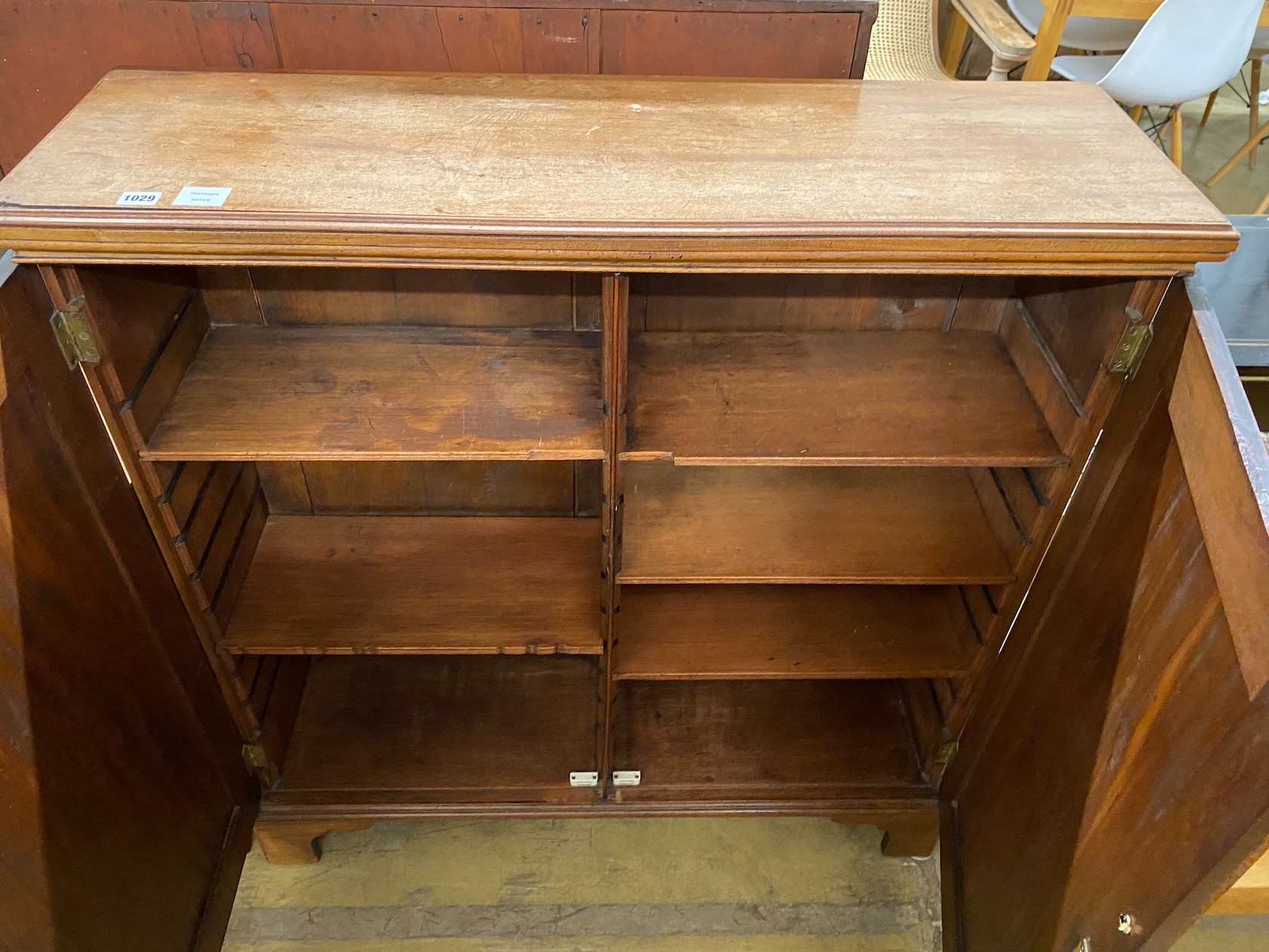 An early 19th century mahogany two door cupboard width 107cm, depth 33cm, height 113cm.
